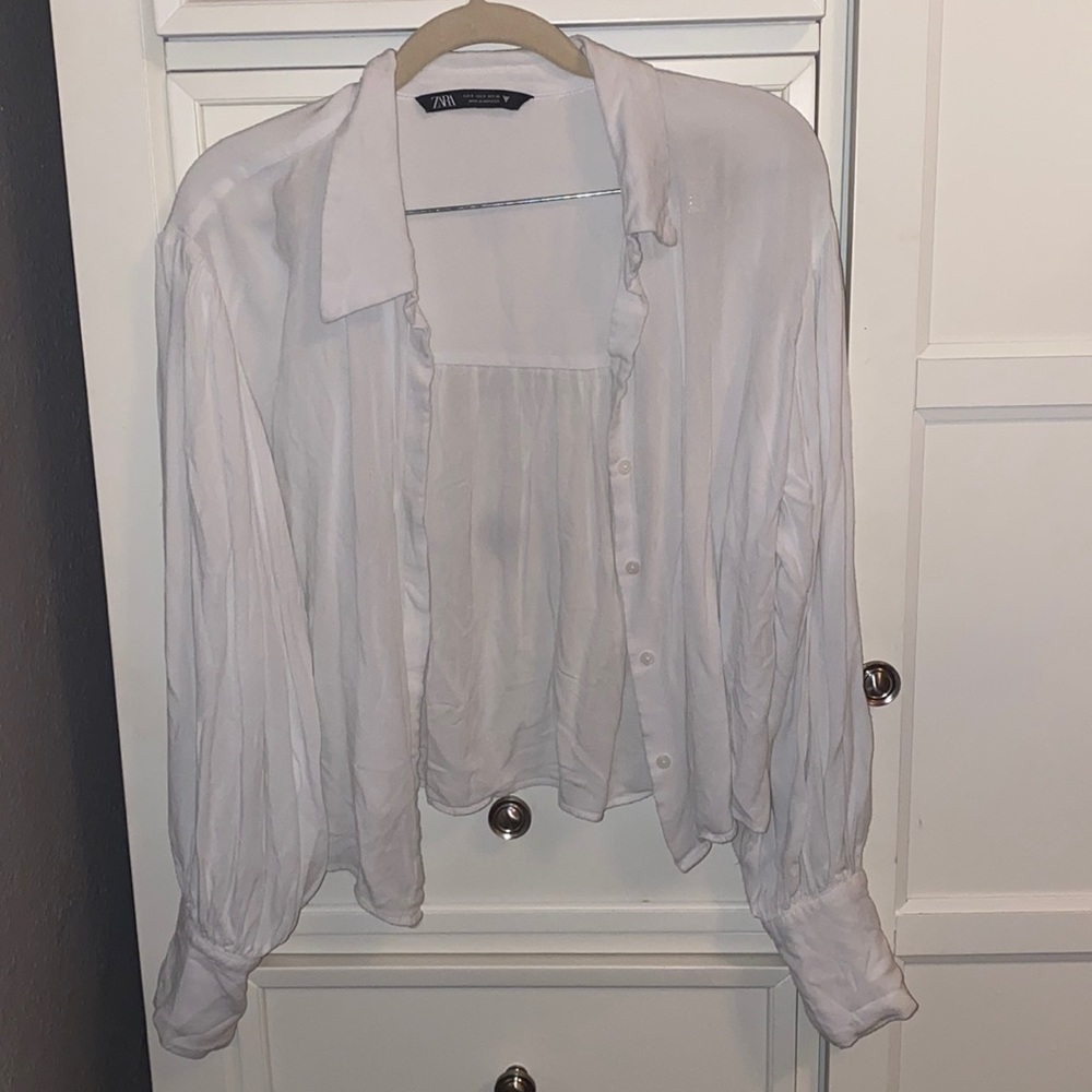 White Zara’s button up shirt.
